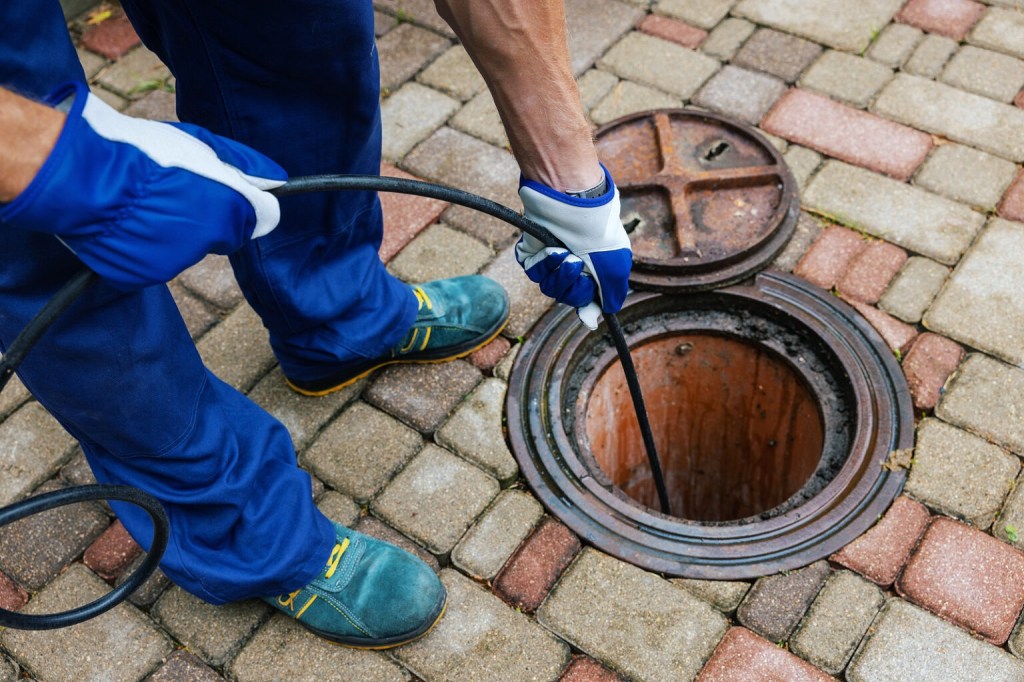 Sewer Cleaning Service – Worker Clean A Clogged Drainage With Hydro&nbsp;Jetting